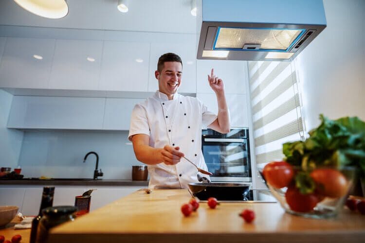 a private chef prepares a meal for guests staying at Reve Resort Orlando