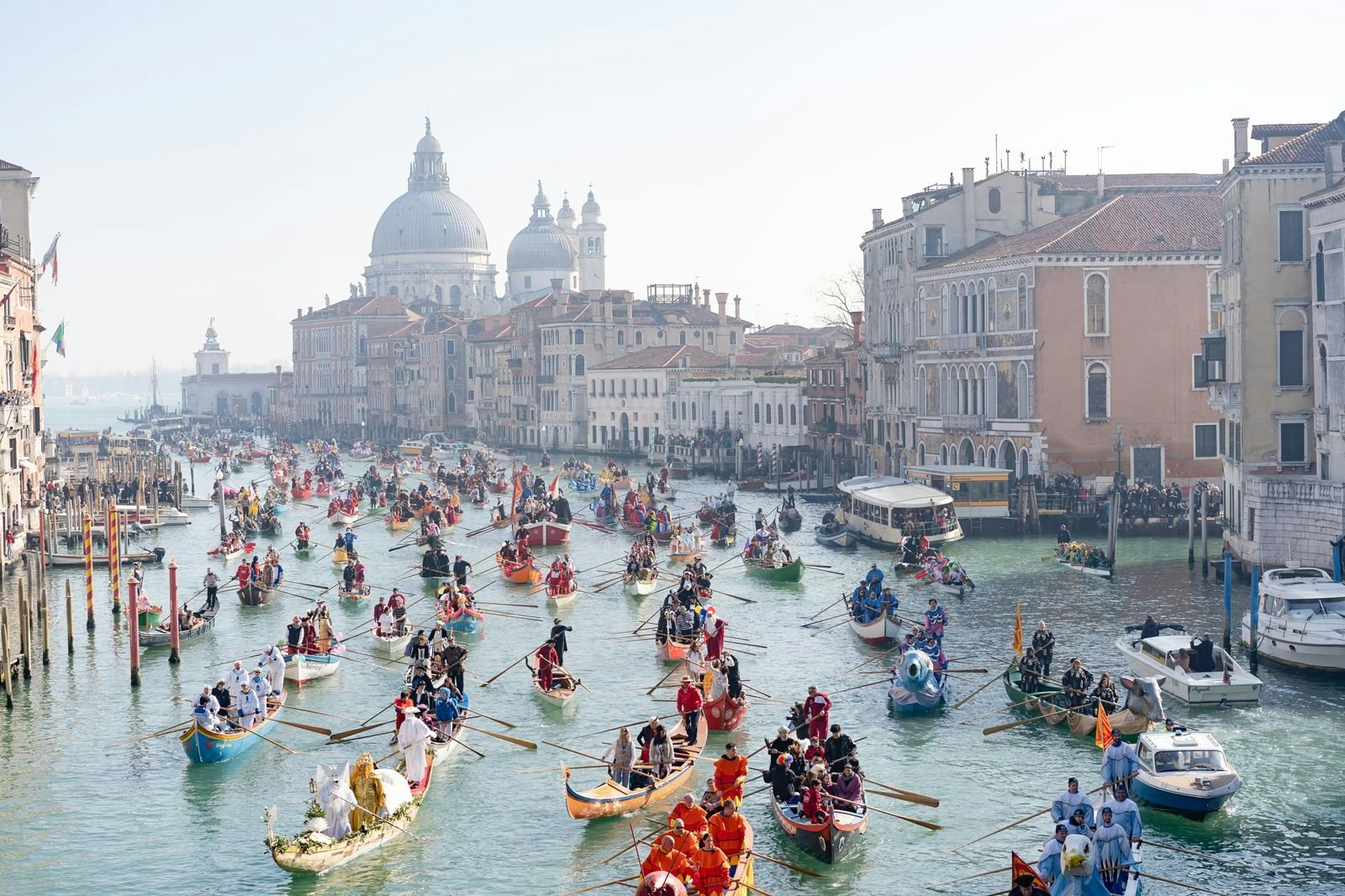 Lots of boats on the Grand Canal in Venice celebrating the carnival