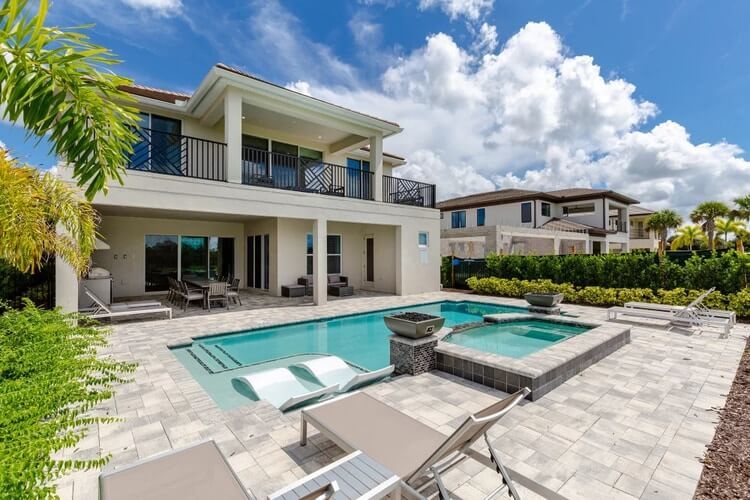 pool and hot tub in garden of white villa