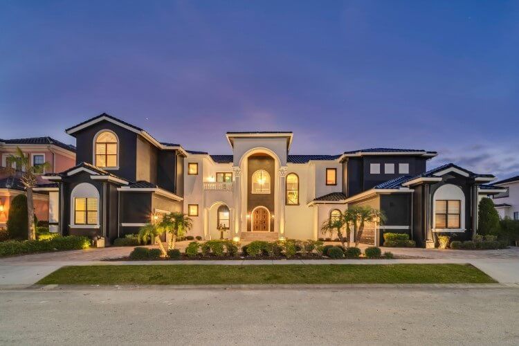 white and black villa at dusk