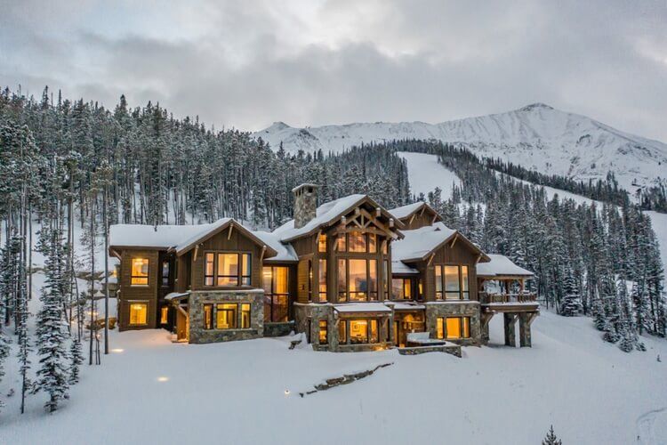 big sky 84 cabin surrounded by snow
