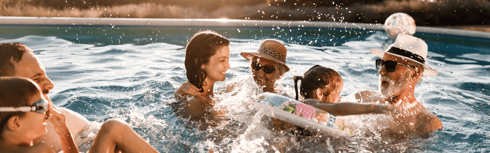 Multigenerational family playing in pool