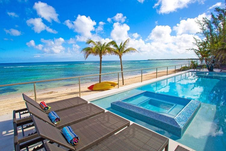 Twin Palms Grand Cayman 7 bedroom oceanfront vacation rental by the beacy