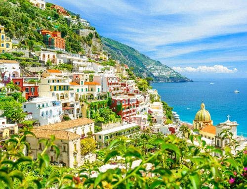 Amalfi Coast view of colorful buildings on cliffsides by the sea