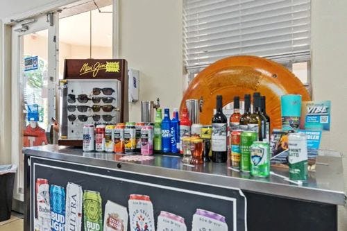 Windsor Hills shop stand with drinks, sunglasses, and gifts