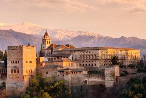 The Alhambra palace in Grenada with mountains behind