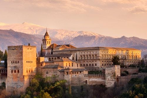 The Alhambra palace in Grenada with mountains behind