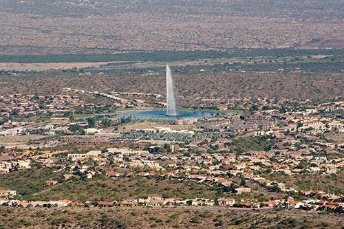 A tall fountain jets into the air in Fountain Hills