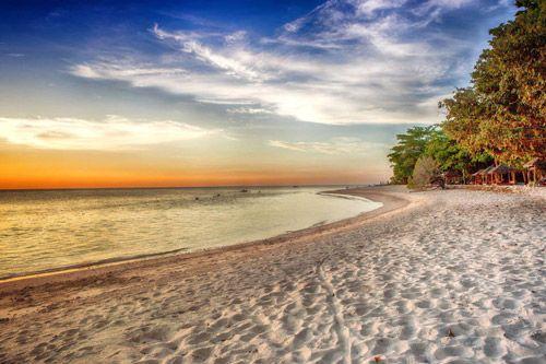 Baie Lonuge beach with white sand and palm forest