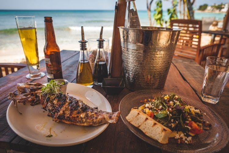 Barbados restaurant with grilled fish, bread and salad