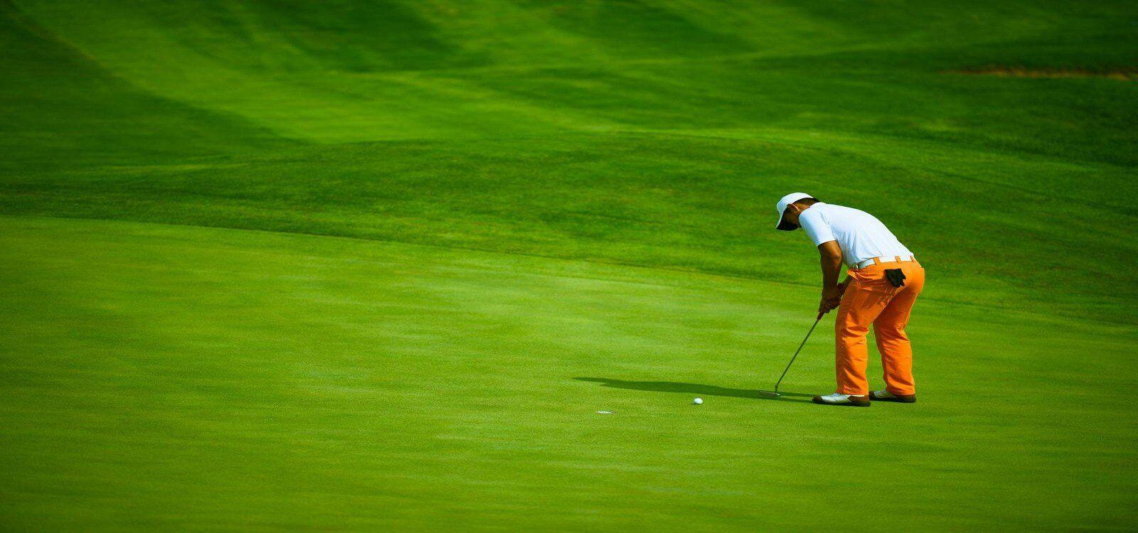 Golfer on the putting green, Barbados golf holidays