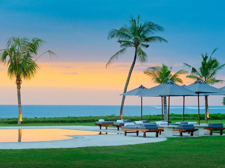 Beach villa Bali Seminyak 5695 - Villa Atas Ombak outside area  with pool, sun lounger, palm trees, and sea view