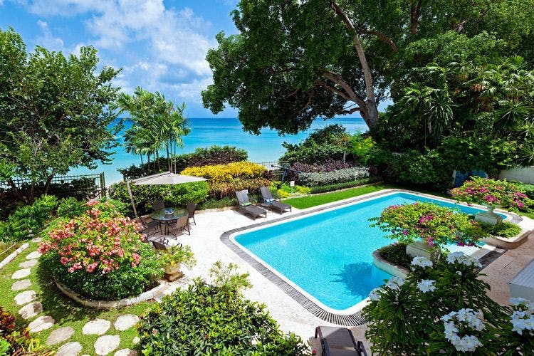Beachfront Gibbs Bay rentals - Bonavista villa landscaped garden and private pool overlooking the beach and sea