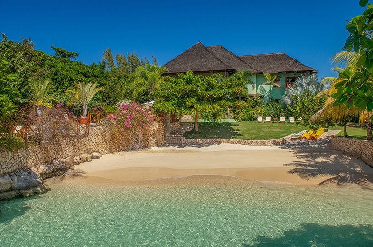 Beachfront villa rentals in Discovery Bay - Whispering Waters On The Beach, luxury villa with private white sand beach