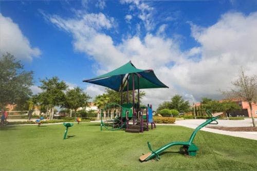 Bella Vida Resort outdoor playground with seesaw and climbing frame
