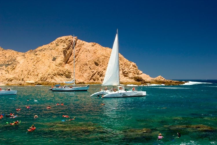 Best time to visit Cabo Mexico, catamaran sailing, Top Villas