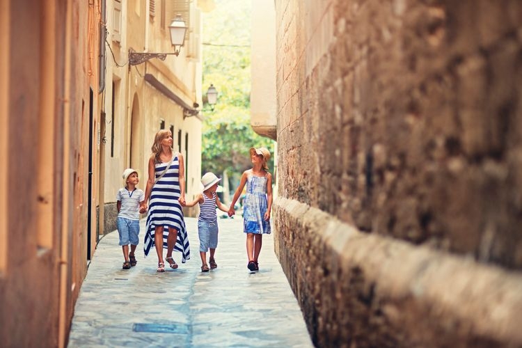 The best time to visit Mallorca, family walk in old town, Top Villas