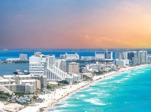 Cancun city along a narrow band of sand in the sea