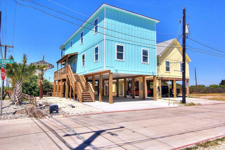 Corpus Christi 11 blue home elevated on wooden stilts