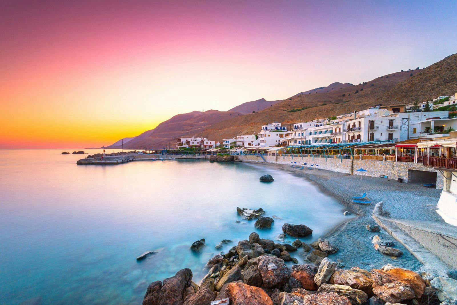 A Cretan village by the sea at sunset