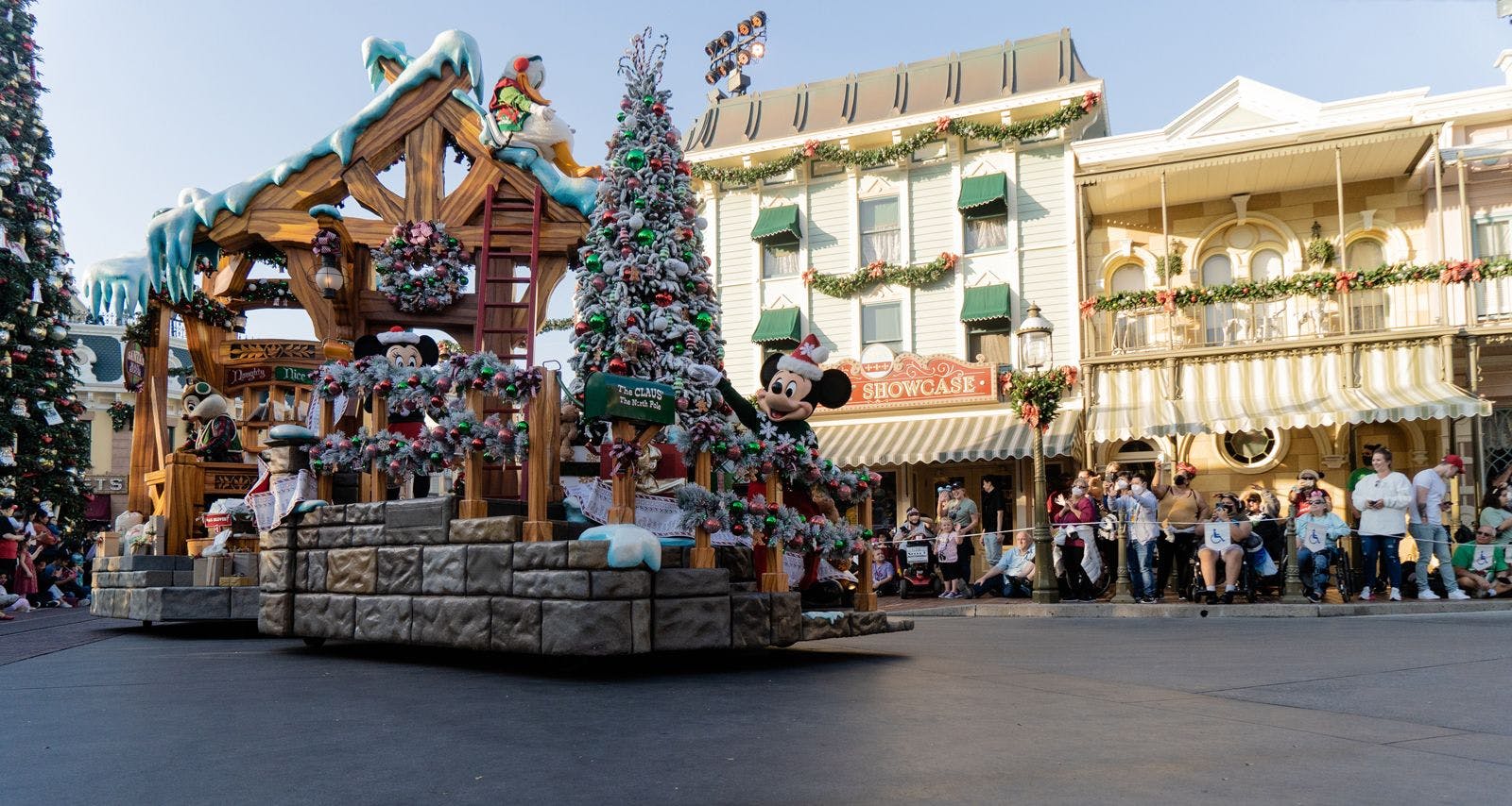 A festive-themed float moves through Main Street in Disney World