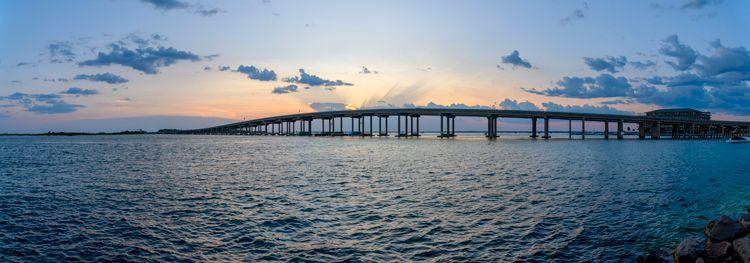 William T. Marler Bridge near Destin from the shore at Norriego Point during sunset