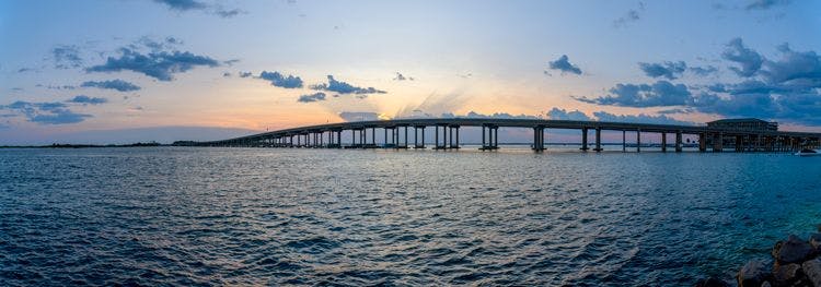 William T. Marler Bridge near Destin from the shore at Norriego Point during sunset