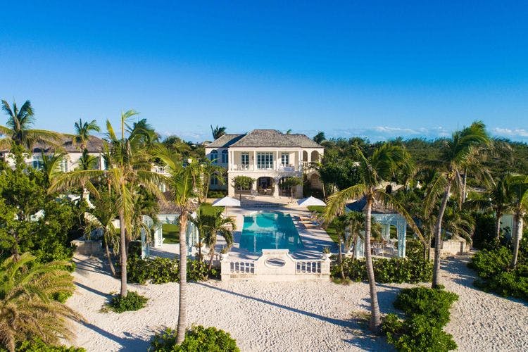 Grace Bay beach house rentals - Coral Pavilion luxury villa on white sand beach