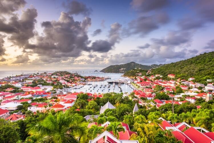The city of Gustavia, St Barts, with red-roofed buildings and a harbor