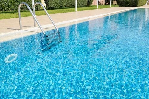 Metal steps going into a swimming pool