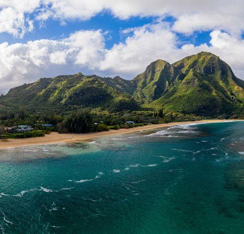 Hawaii island view from the air with forest-covered mountains, and volcanoes