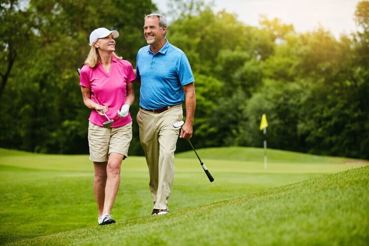 Couple enjoying the fairways of the Highlands Reserve golf club
