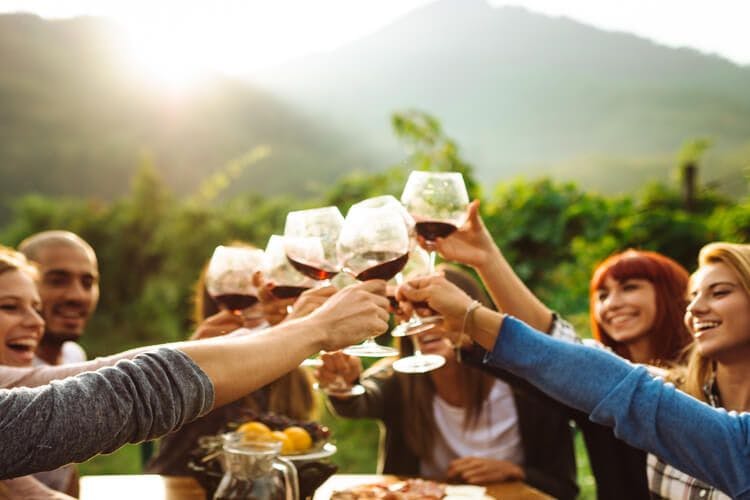 Friends enjoy wine tasting in Chianti Tuscany