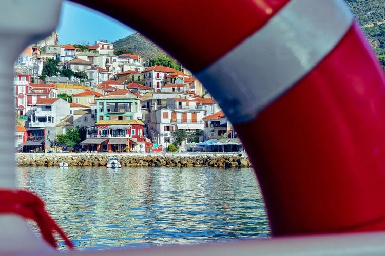 A view from a boat of a town on Antipaxos
