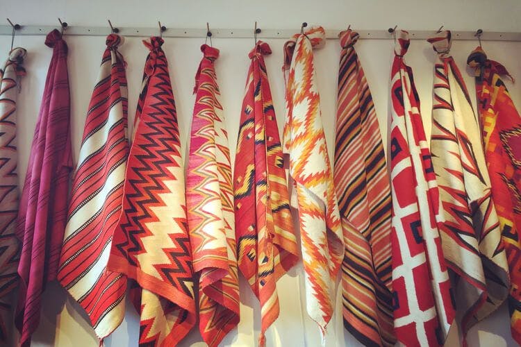 Native American textiles hang up on a wall in Taos, New Mexico