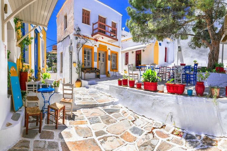 A quaint and colorful square in Lefkes, Paros