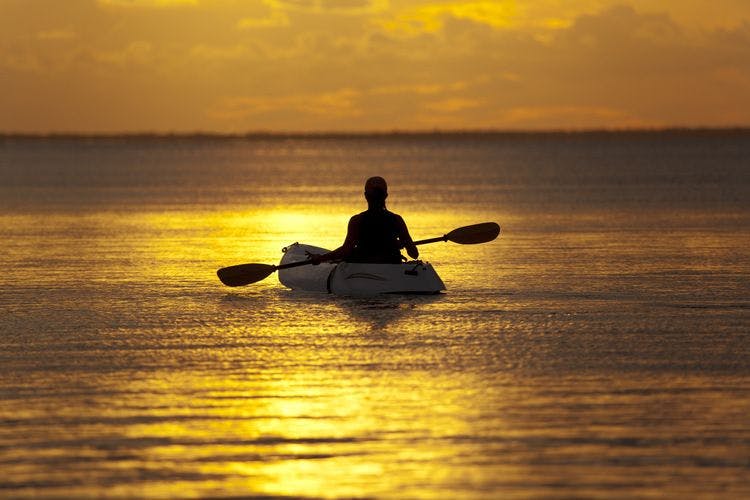 Kayaker at sunset off Islamorada in the Florida Keys