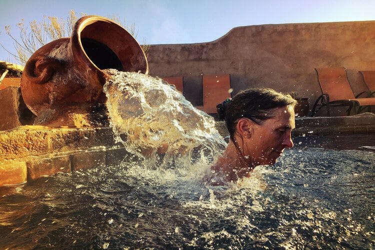 A person enjoys a water spa treatment in New Mexico