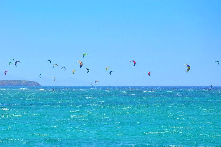 Kite surfers enjoy the wind off of Paros in Greece