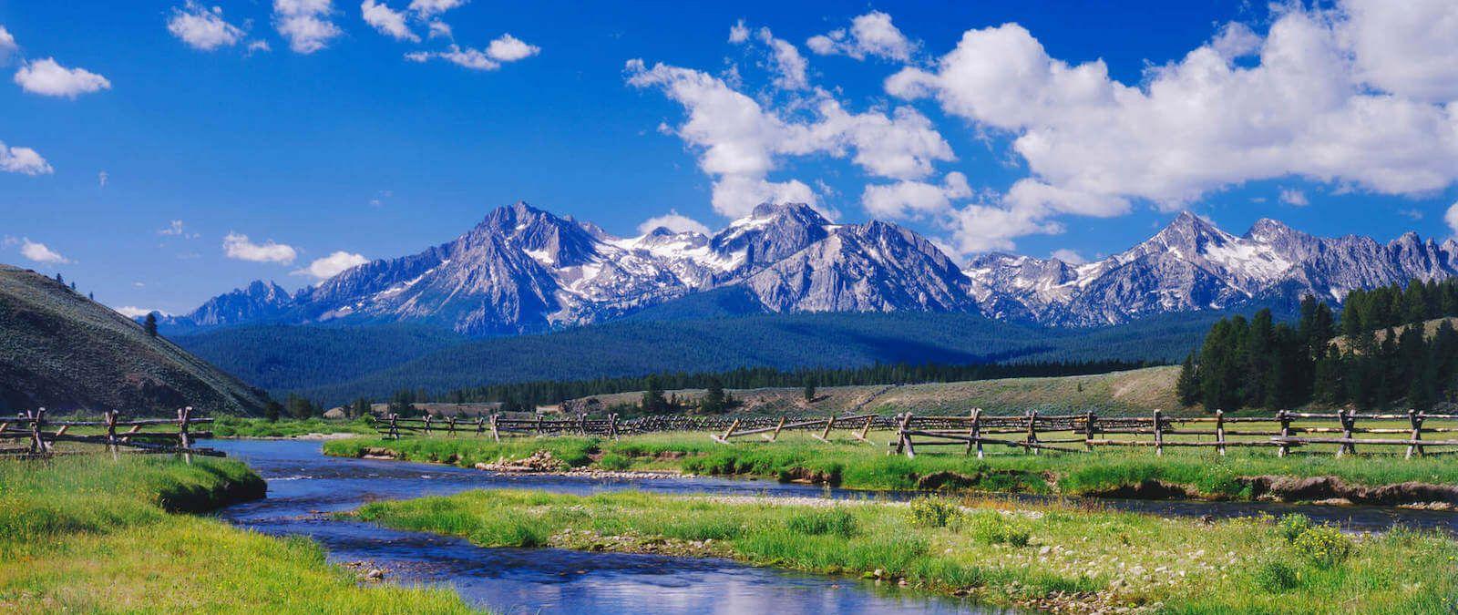 Idaho landscape with mountains, fields, and a river