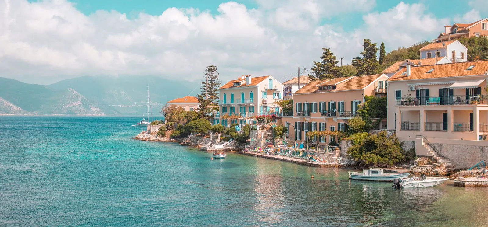 Fiskado village in Kefalonia with pastel-colored buildings by the sea