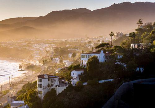 Sunrise over coastal villas and Malibu beach