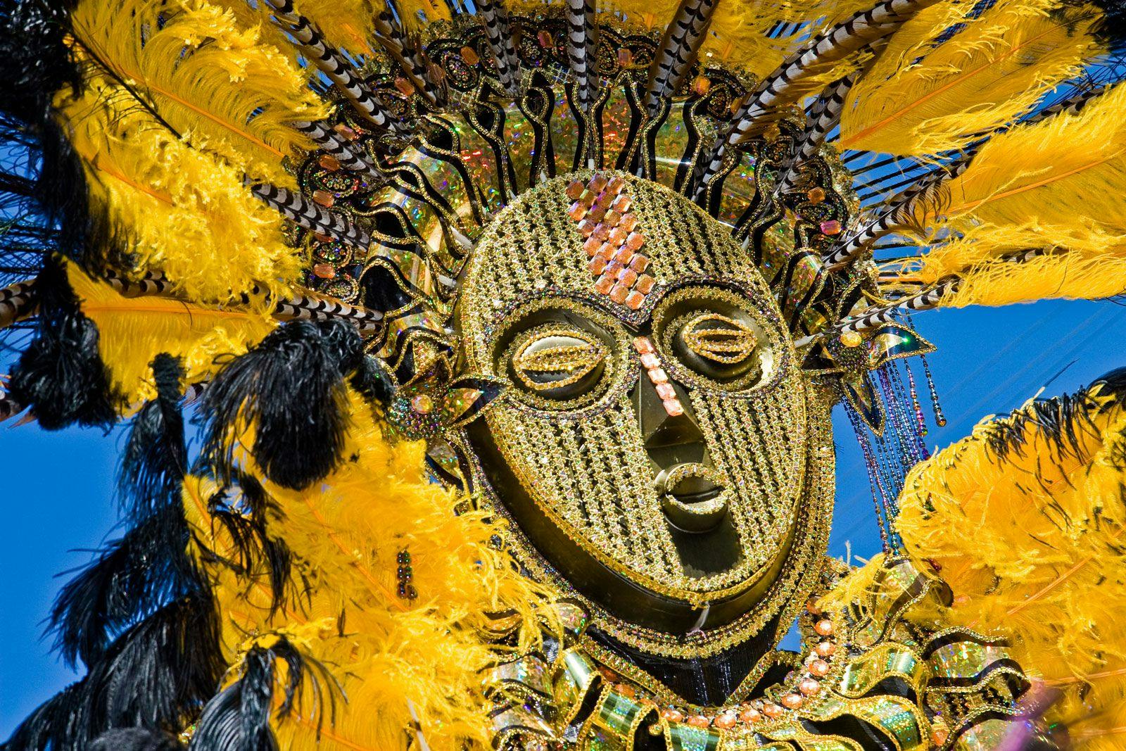 A golden feathered festival mask