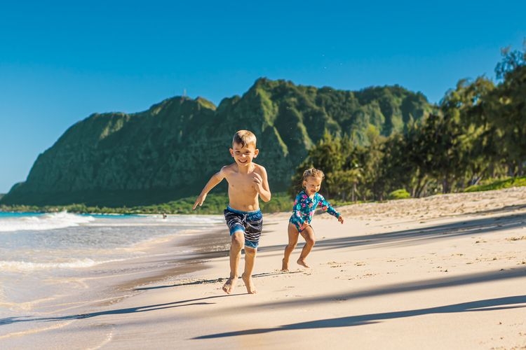 Mexico vs Hawaii vacation, kids running on the beach, Top Villas