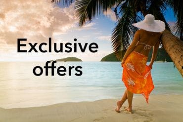 A woman in a white sunhat and ornage dress leaning against a palm tree on a Caribbean beach with the words 'exclusive offers' next to her