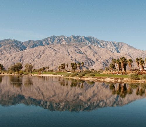 Palm Springs mountains reflected in a still lake