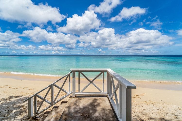 Picture-perfect views at Gibbes Beach rentals - Clearwater Gibbes Beach wooden and stone steps leading to a white sand beach with views of clear sea