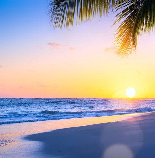 Sunrise on a white sand beach in Barbados