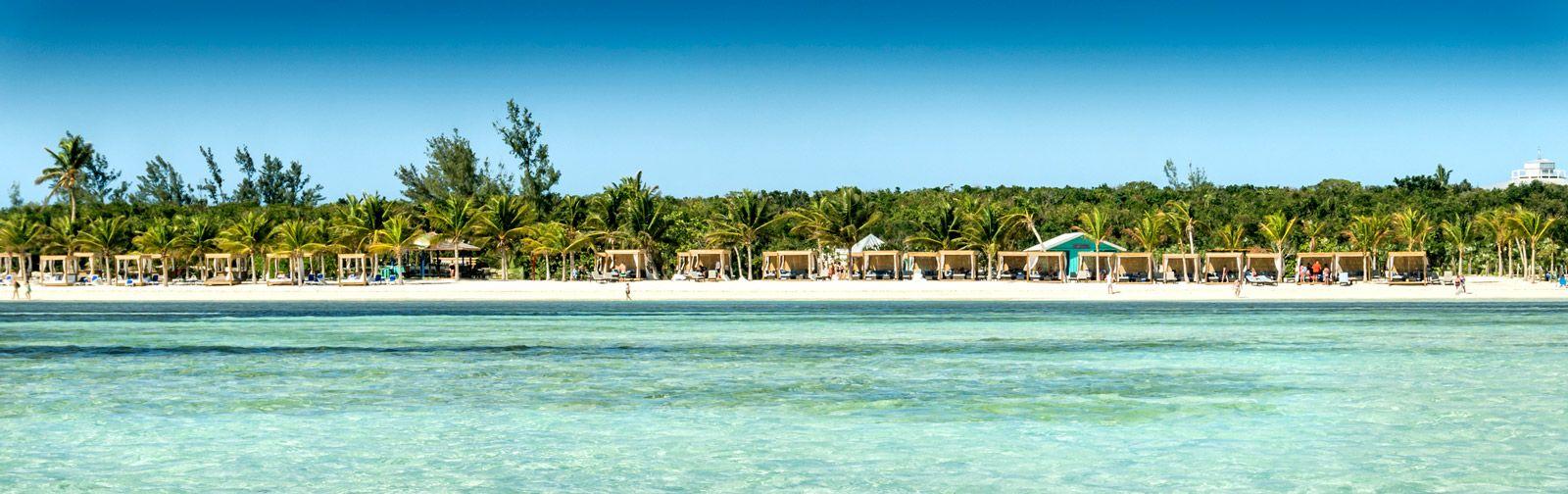 White sand beach with cabana sunbeds