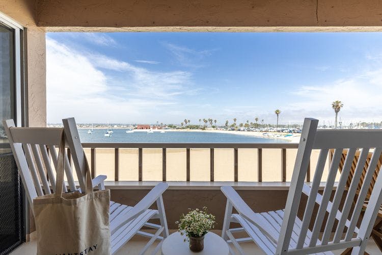 San Diego beach house rentals - San Diego 218 porch with chairs on a white sand beach